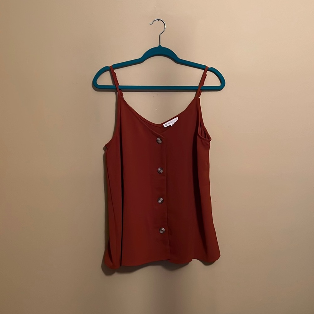 Rust colored tank with button details in front